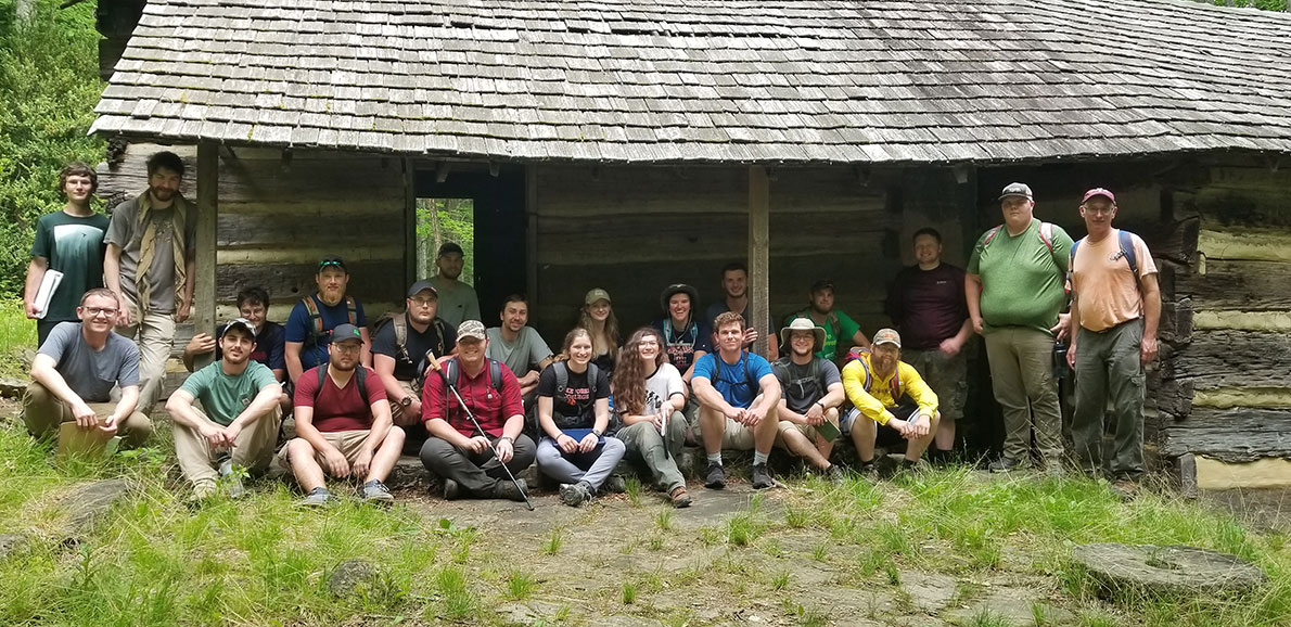 group pic rustic shelter in the smoky mountains