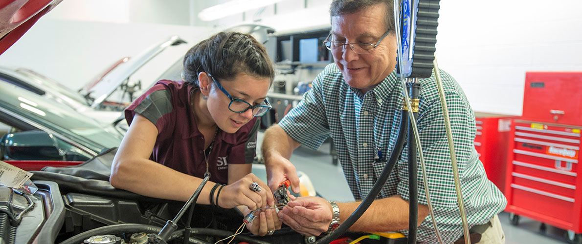 SIU Auto student works on wiring with Professor