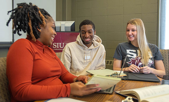 Group of SIU Business Analysis Students work on a project together