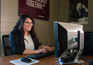 SIU business Administration student working on a computer