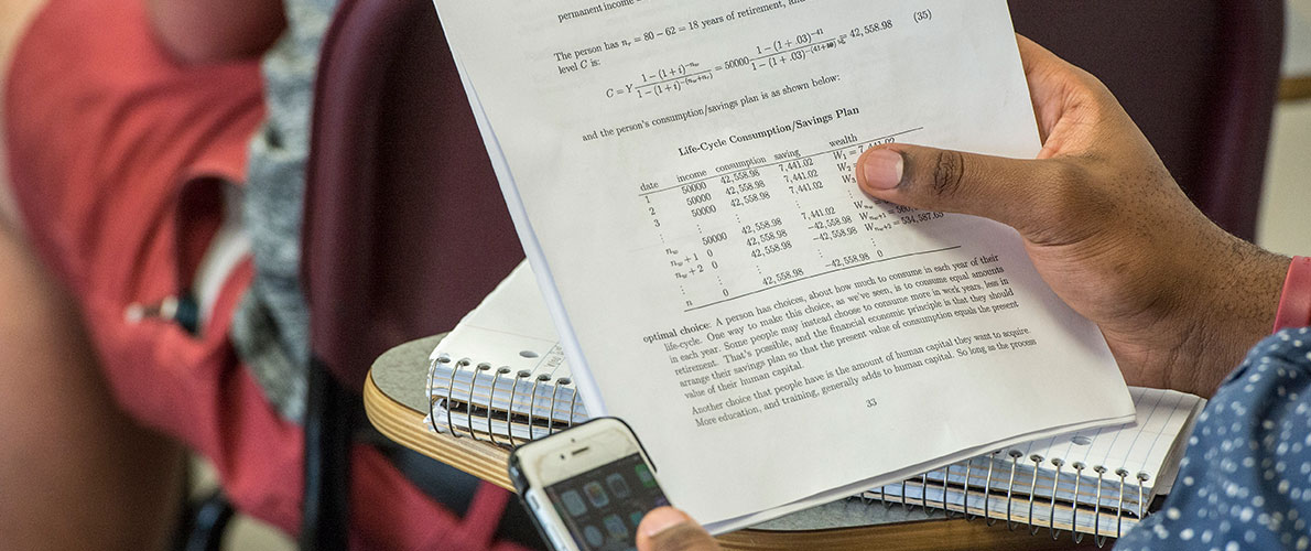 Quantitative Economics students review test at SIU