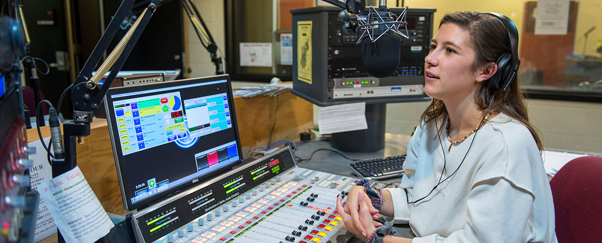 communication student talking into microphone