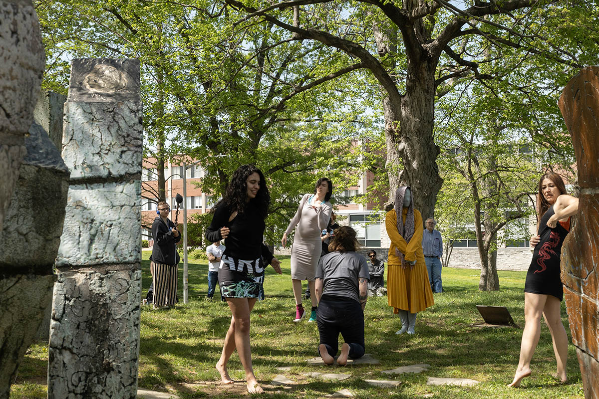Students peruse through SIU MFA student Saba Raissan's performance