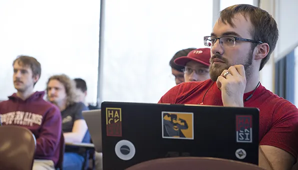 SIU Computer Science Student working on computer