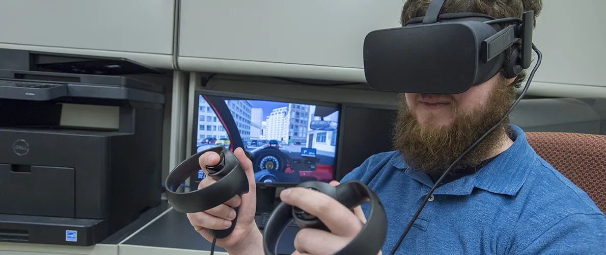 SIU Computer Science student works on a VR headset