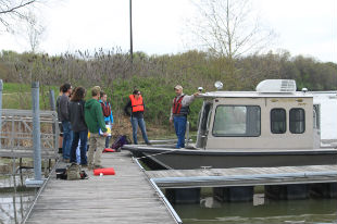 Remo and students with boat