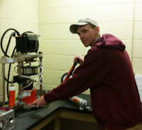 student with equipment