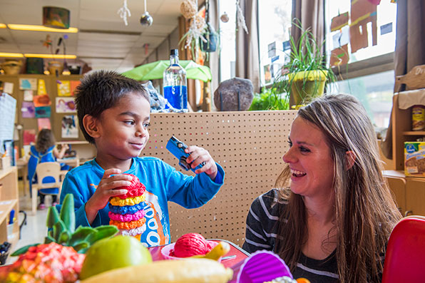 SIU Student works with young boy in the Child Development Lab 