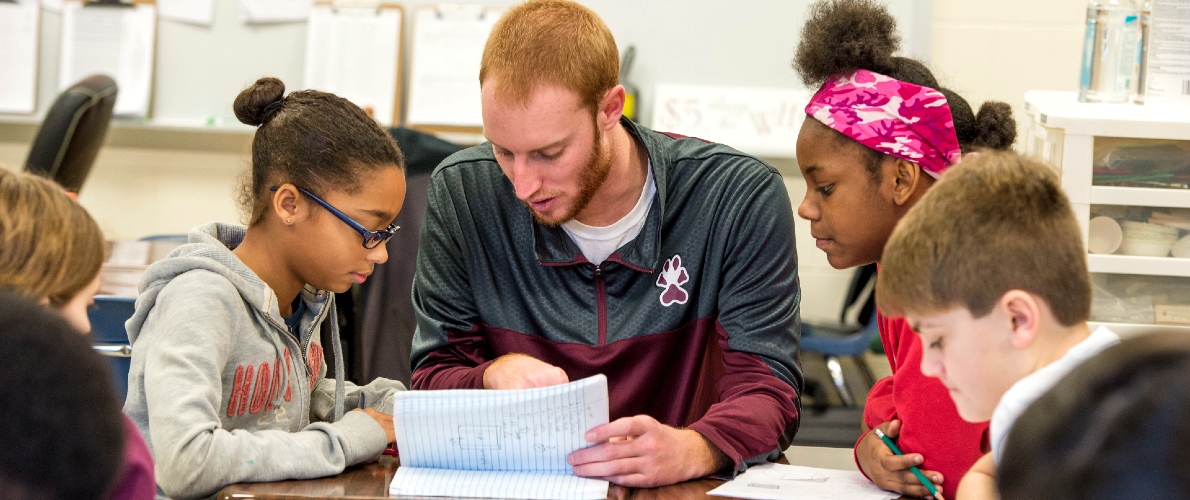 Student teacher with children