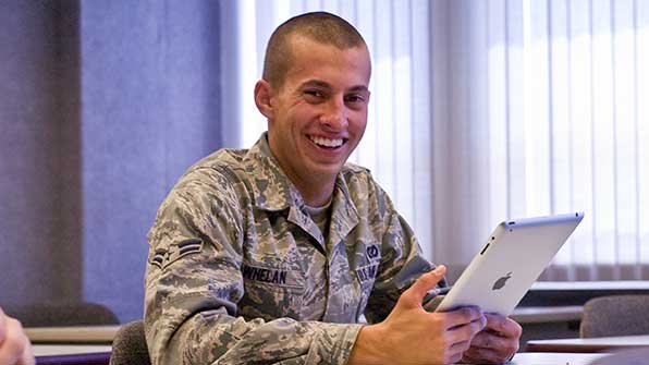 OLID Student in class looking at an iPad