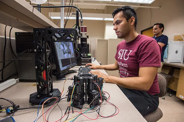 siu electrical engineering student working on a computer
