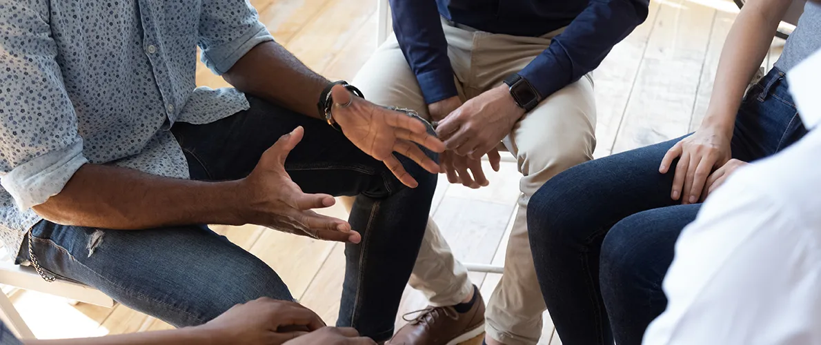 Group of people in a circle talking