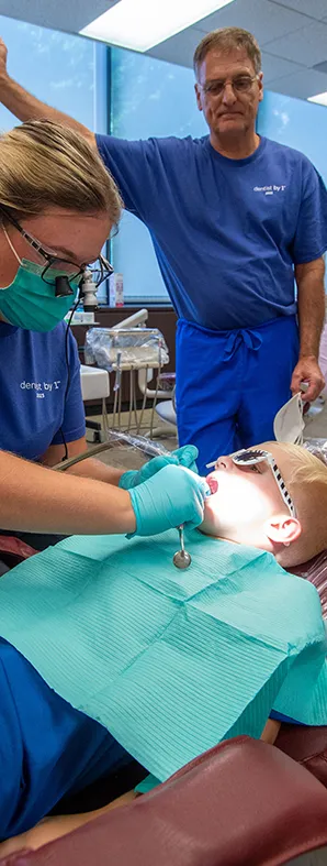 Dental Hygiene Student works on a child in the Clinic