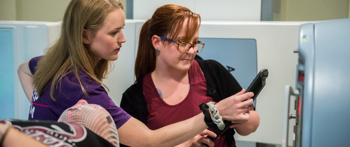 Radiation Therapy students operating machine