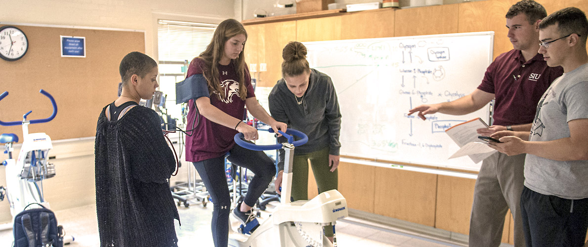 Kinesiology students measuring heart rate