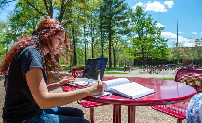 SIU social work student studying outside