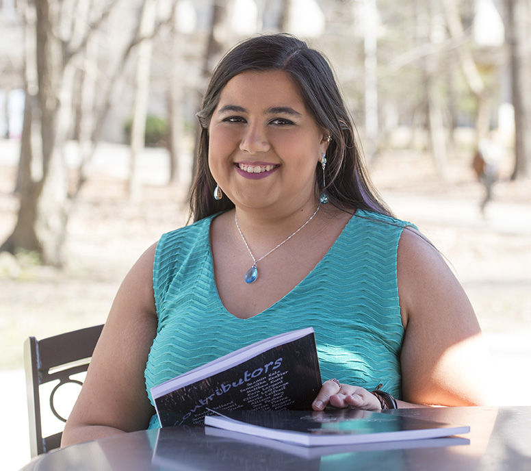 SIU student worker studying outside